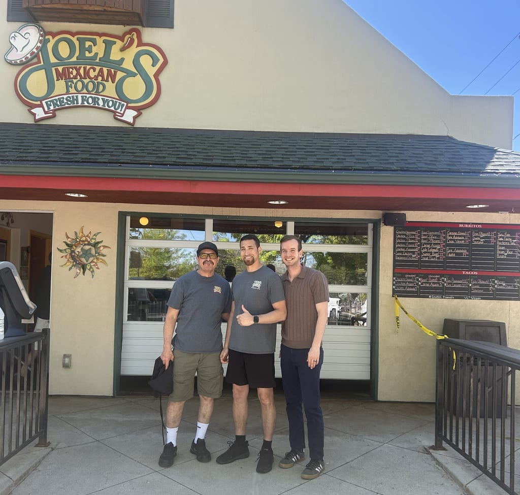 Joel of Joel’s Mexican Restaurant in Sandpoint with the Marks Insurance Agency team outside the restaurant